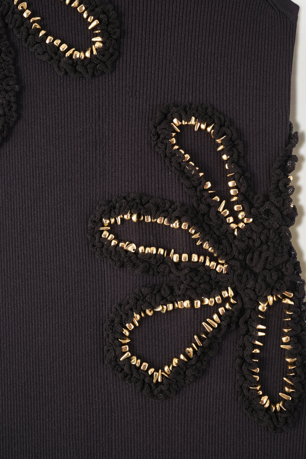 Dress with flowers embellished with gold jewelry