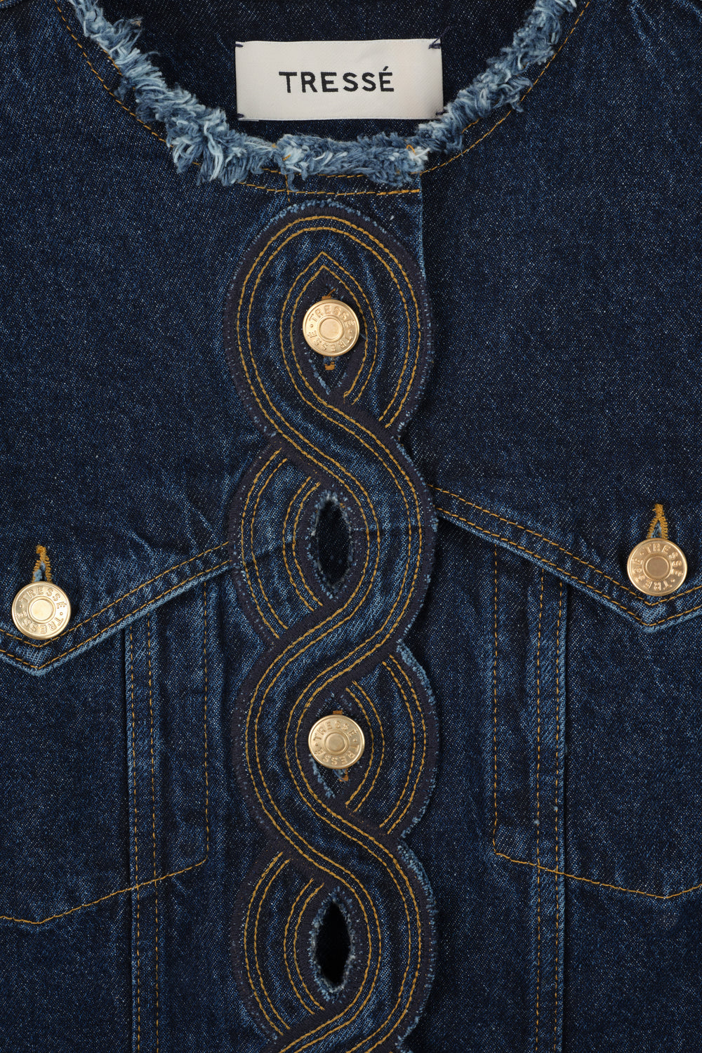 Denim jacket with braided buttonholes