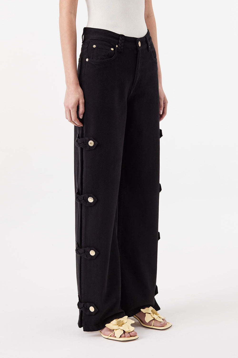 Denim noir ouvert aux côtés avec pattes tressées