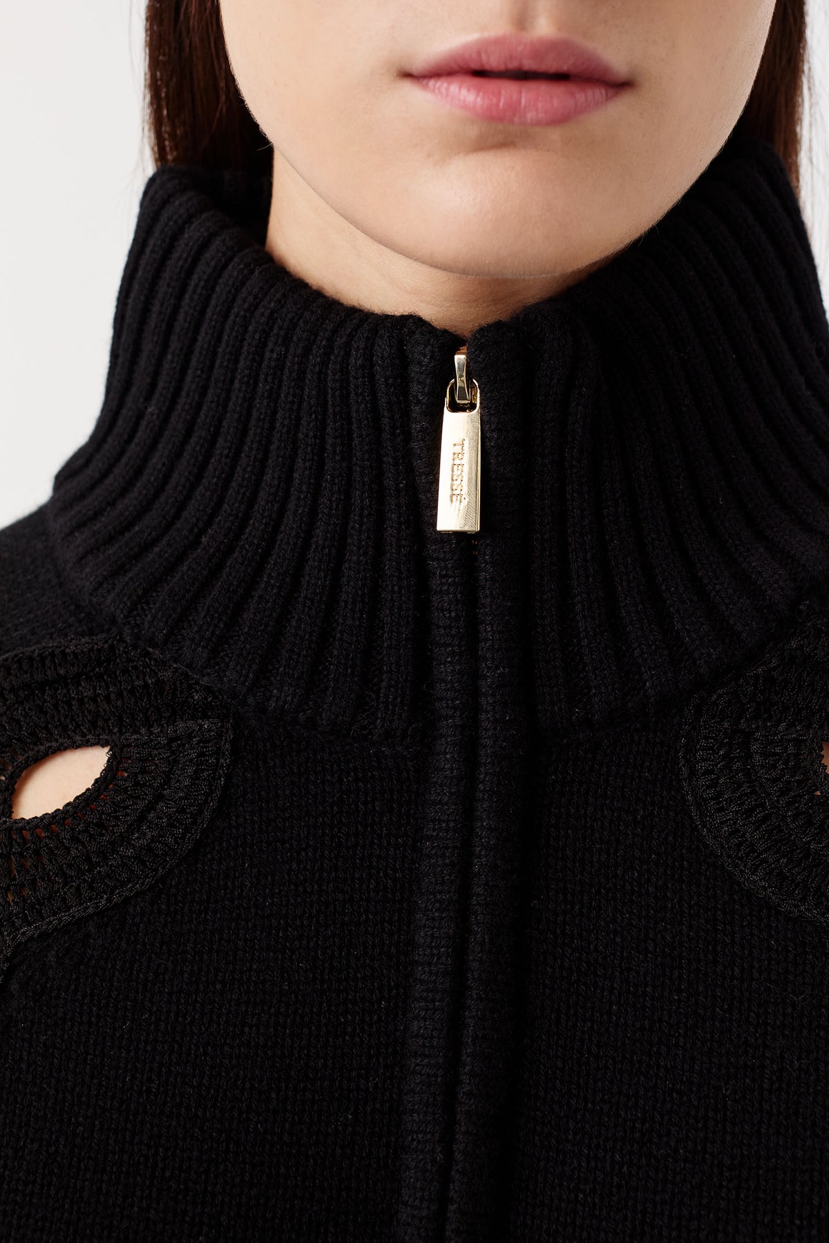 Sweater with braided opening