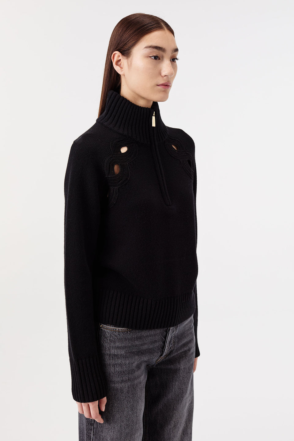 Sweater with braided opening