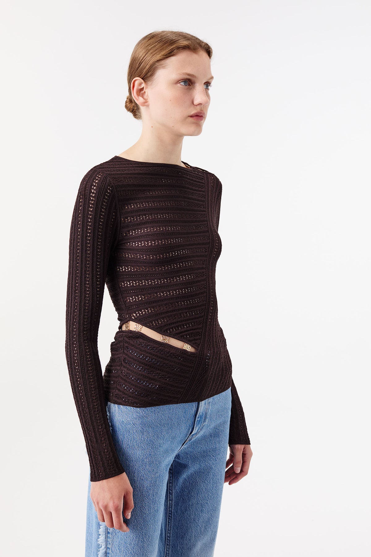 Knit top with asymmetrical cutouts
