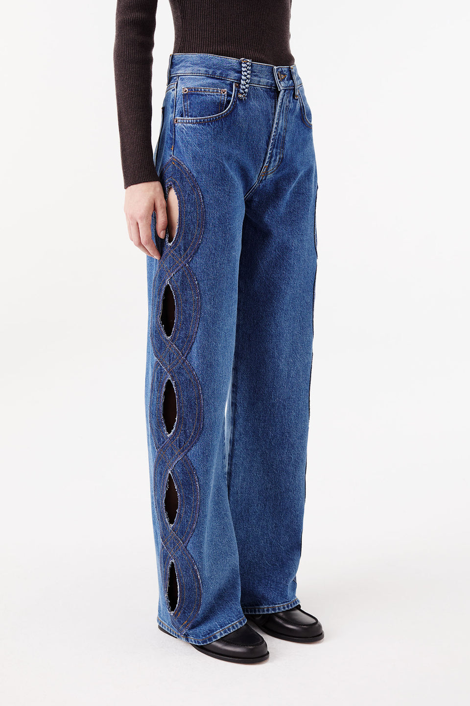 Denim jeans with braided opening