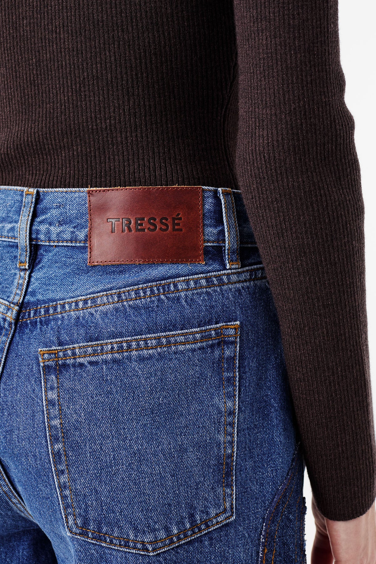 Denim jeans with braided opening