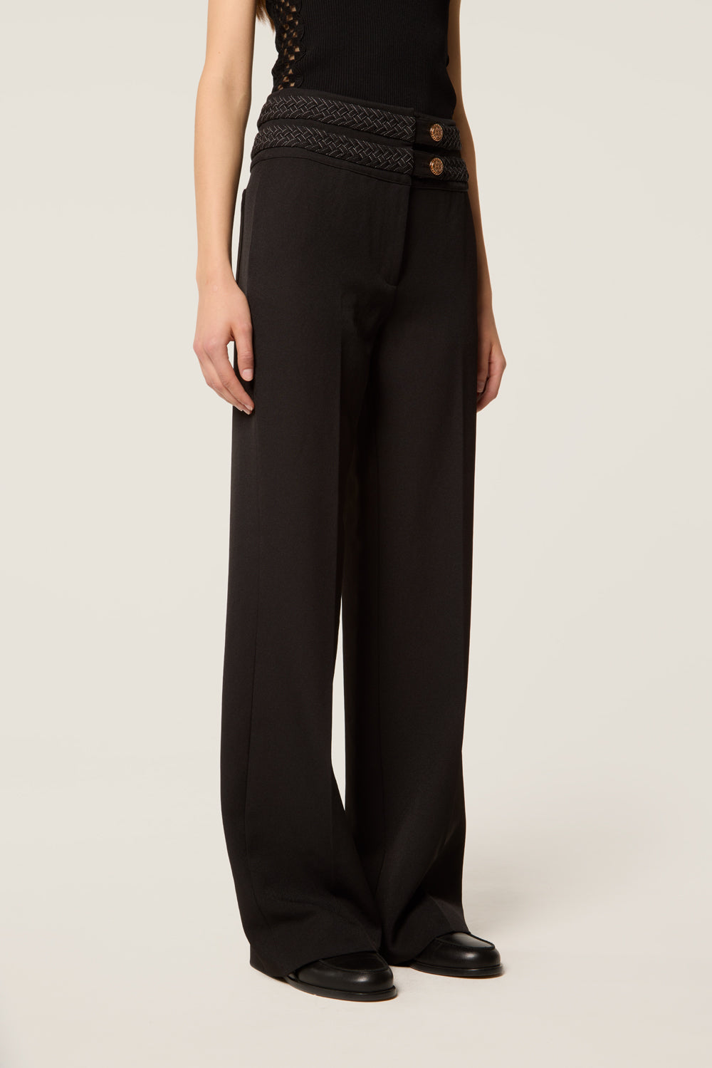Pantalon avec ceinture tresse