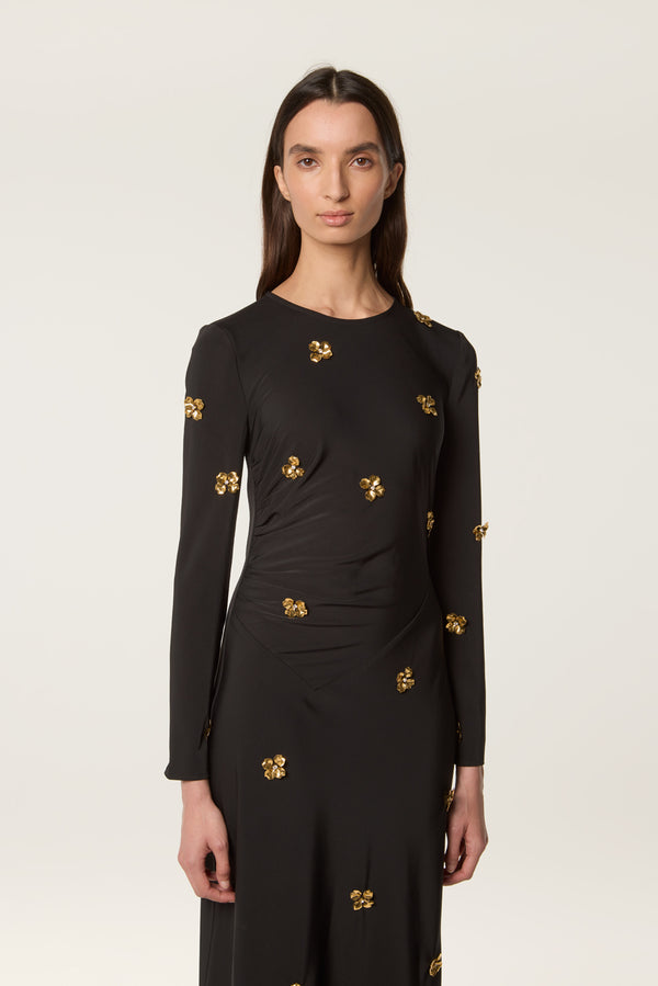 Long dress decorated with golden flowers