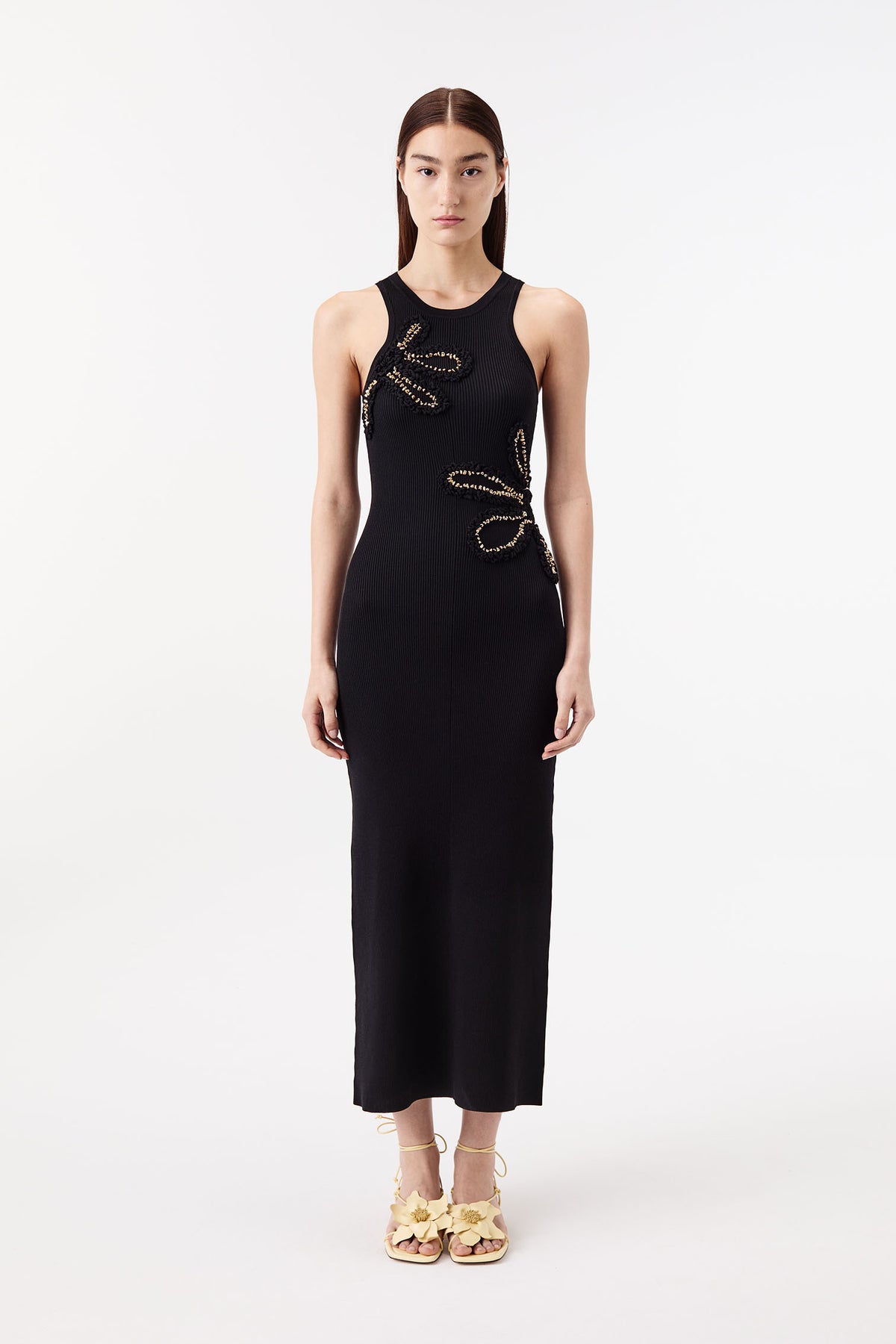 Dress with flowers embellished with gold jewelry
