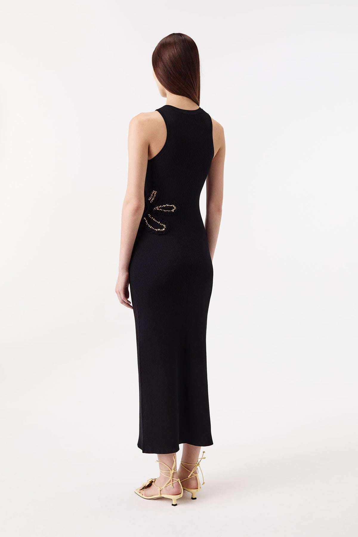 Dress with flowers embellished with gold jewelry