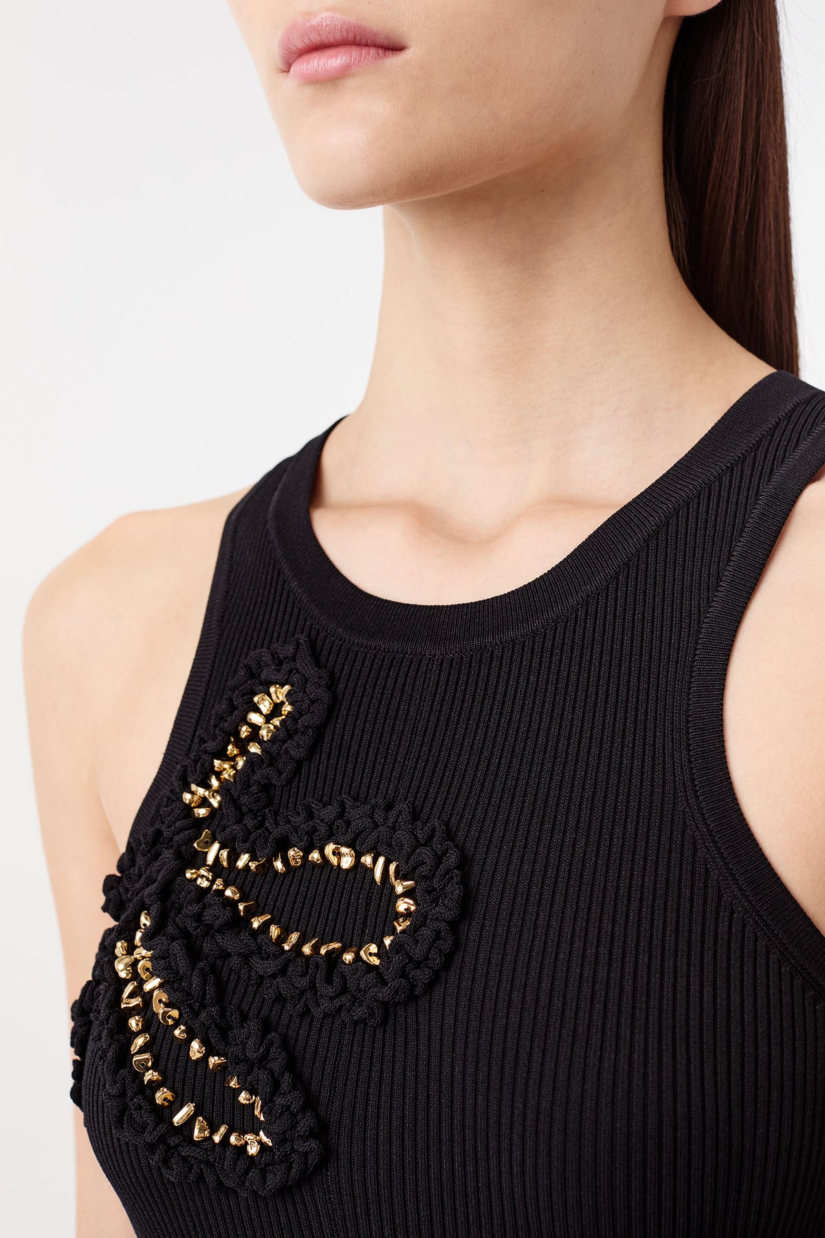 Dress with flowers embellished with gold jewelry