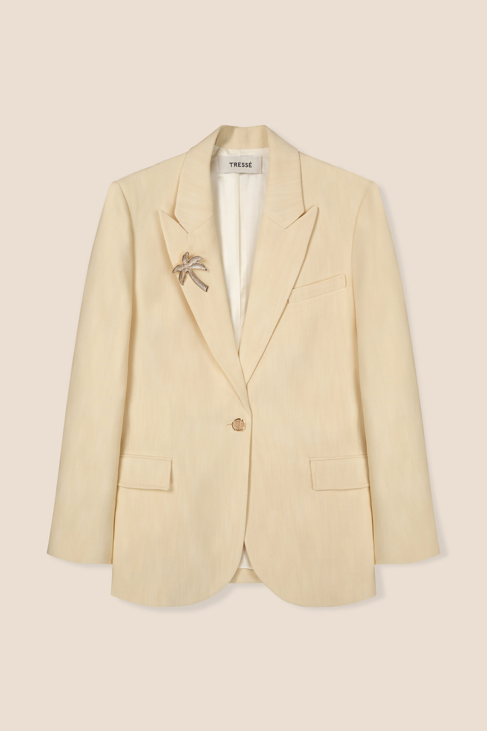 Tailored jacket with palm brooch