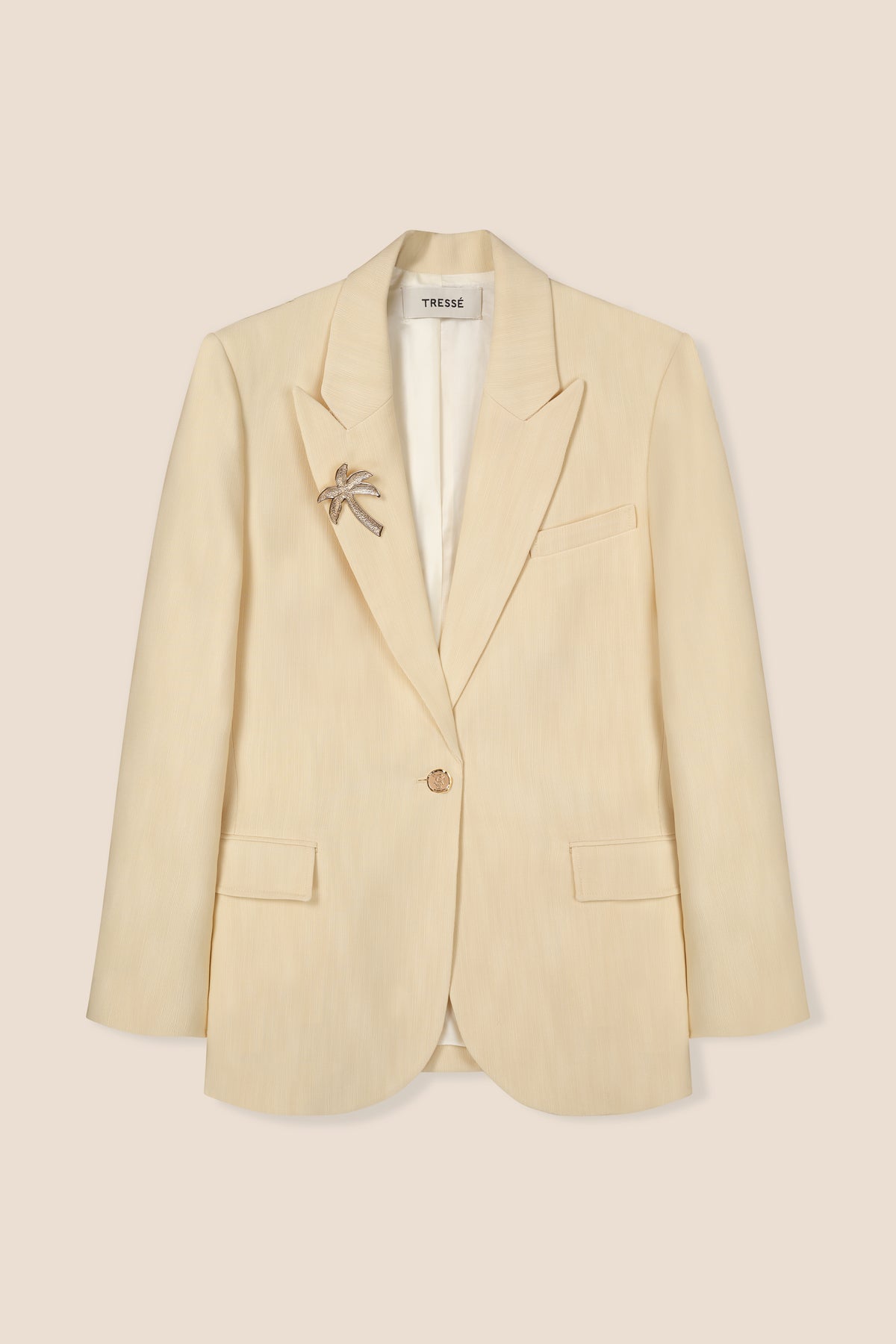 Tailored blazer with palm tree brooch