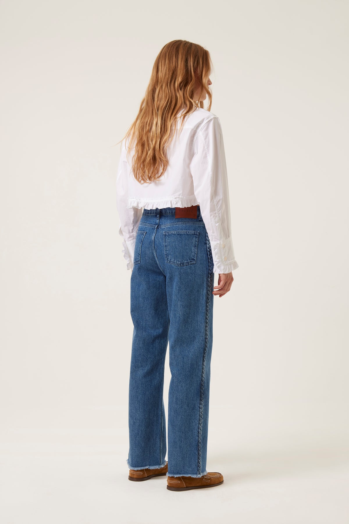 Denim with applied braids