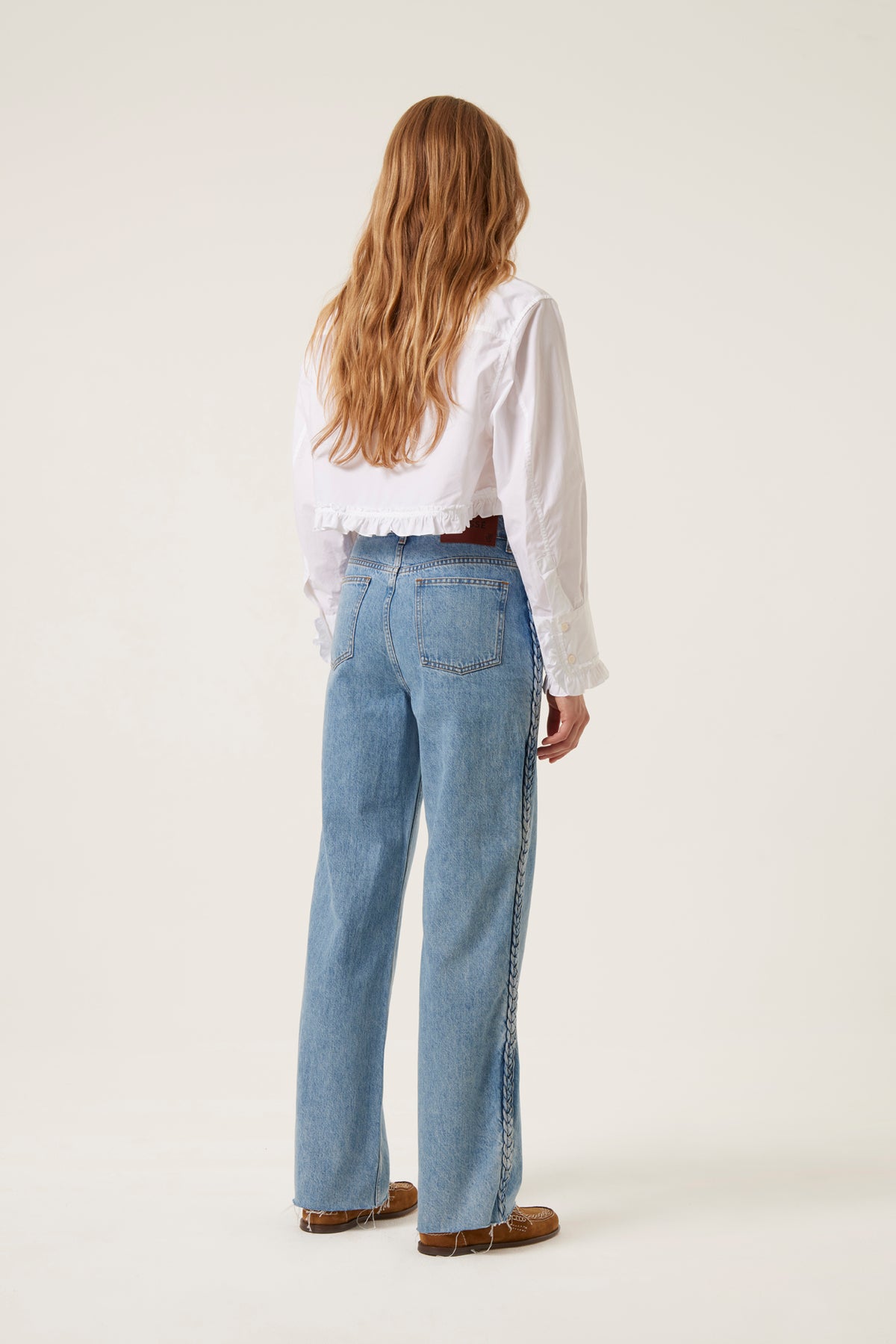 Denim with applied braids