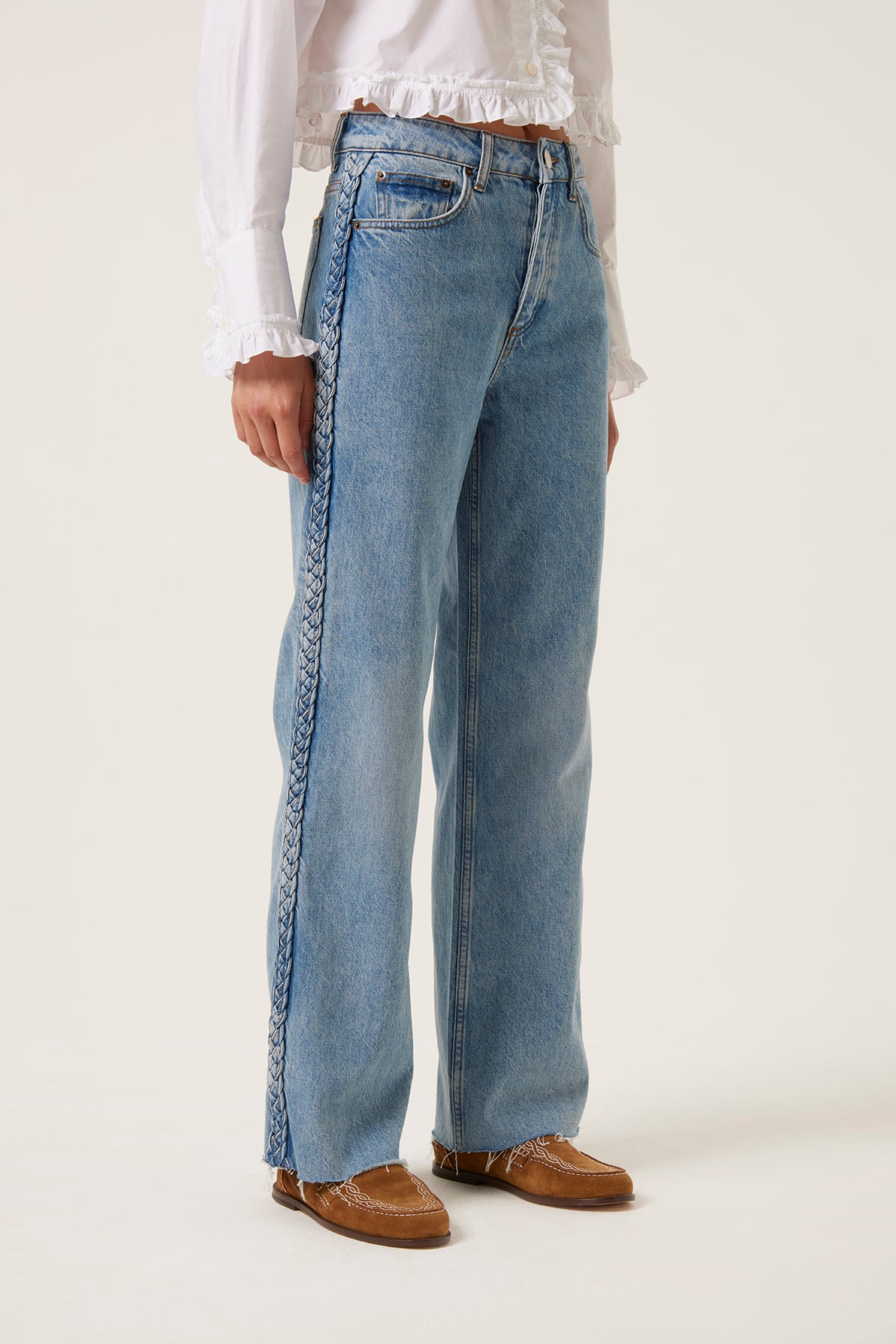 Denim with applied braids