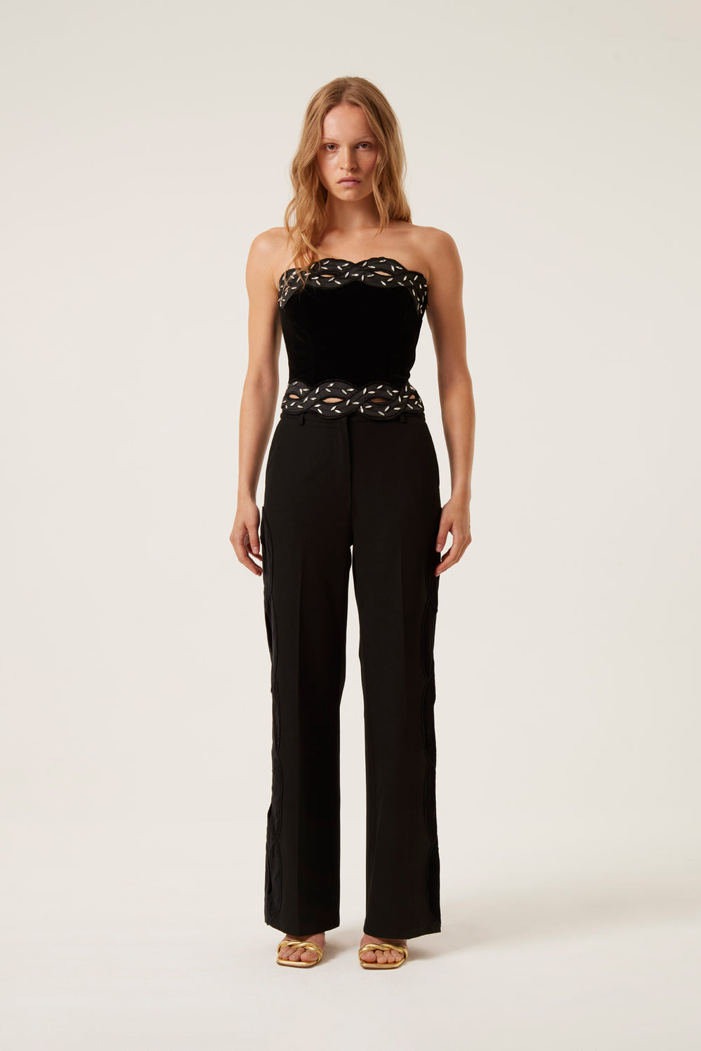 Pantalon avec ouverture tresse