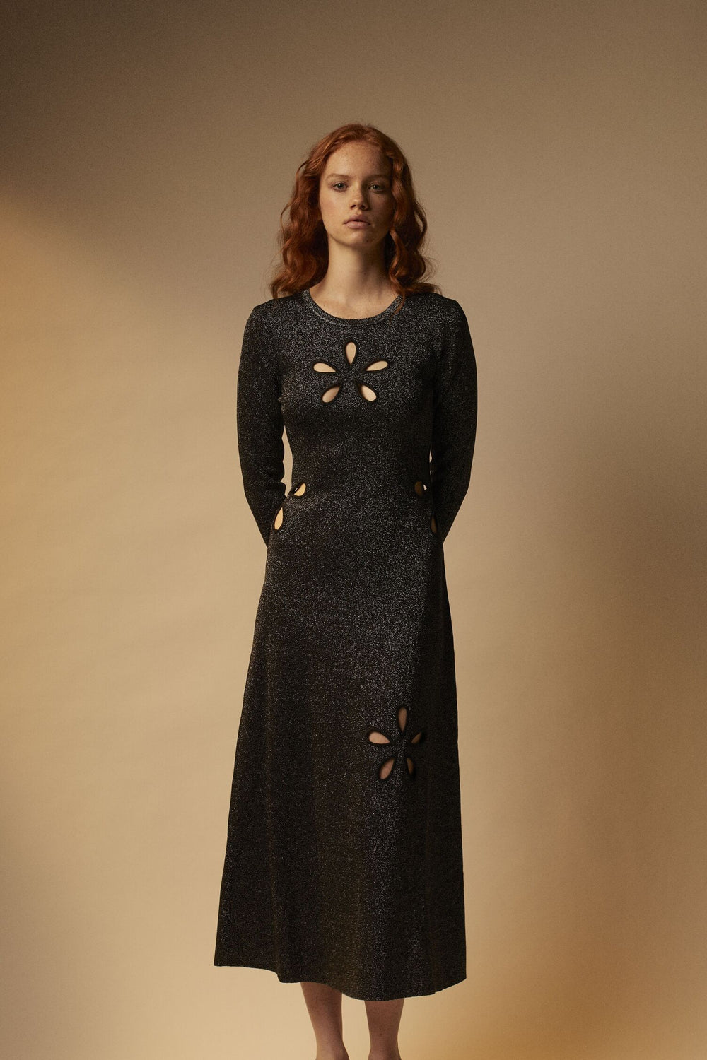 Knitted maxi dress with gold buttons and openings