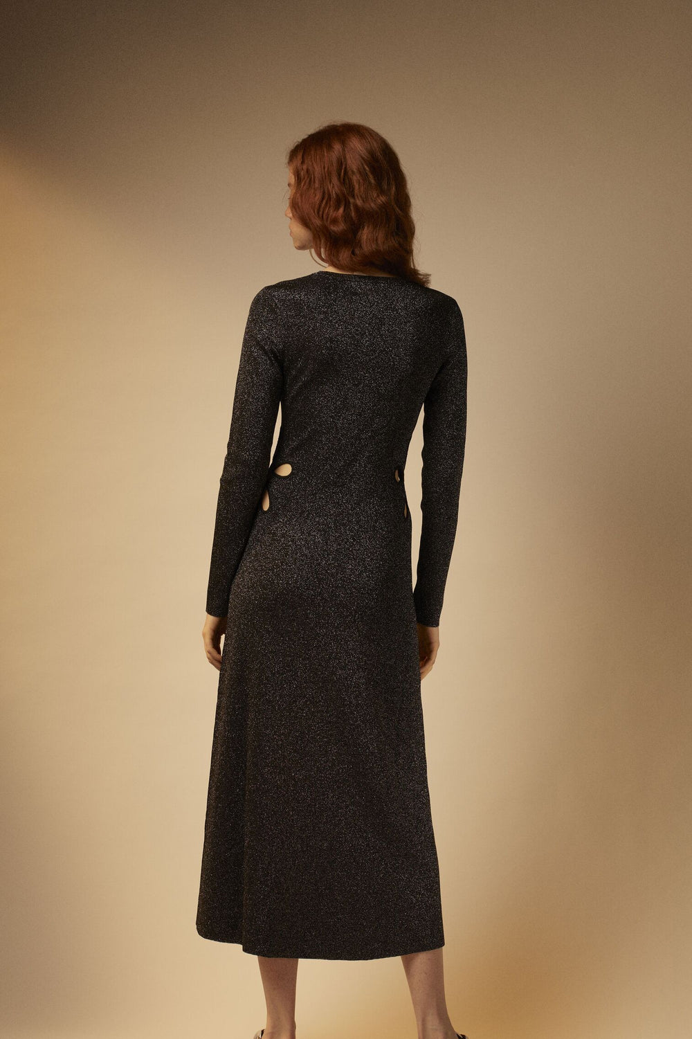 Knitted maxi dress with gold buttons and openings