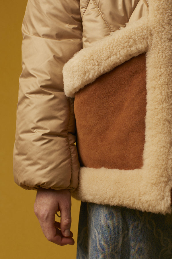 Quilted down jacket with turned-skin details