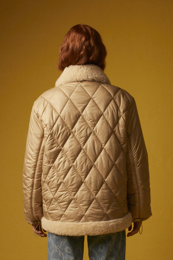 Quilted down jacket with turned-skin details