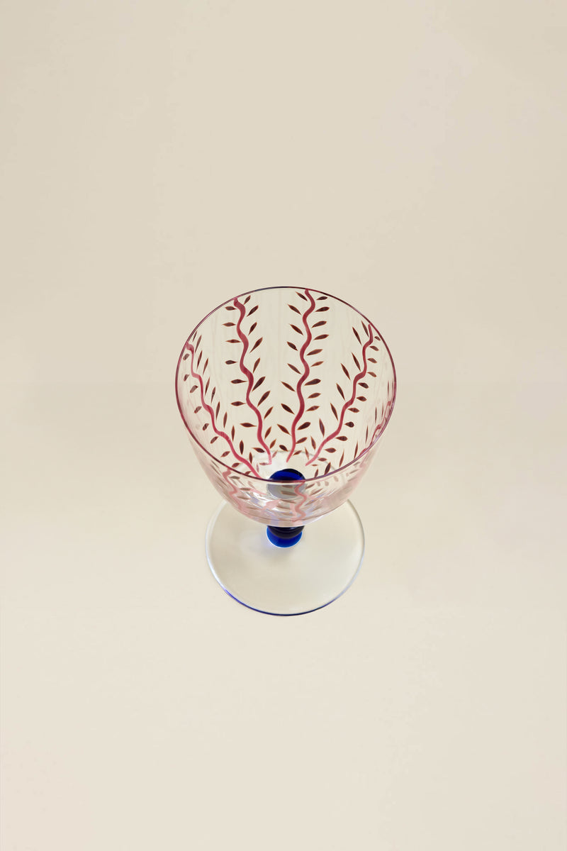 Red stemmed glass with flower motif