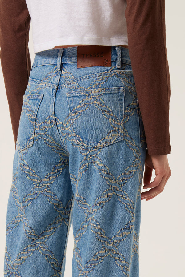 Denim with embroidered braids