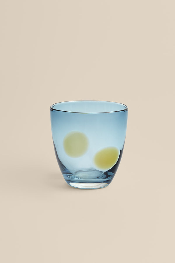 Blue glass with yellow polka dots